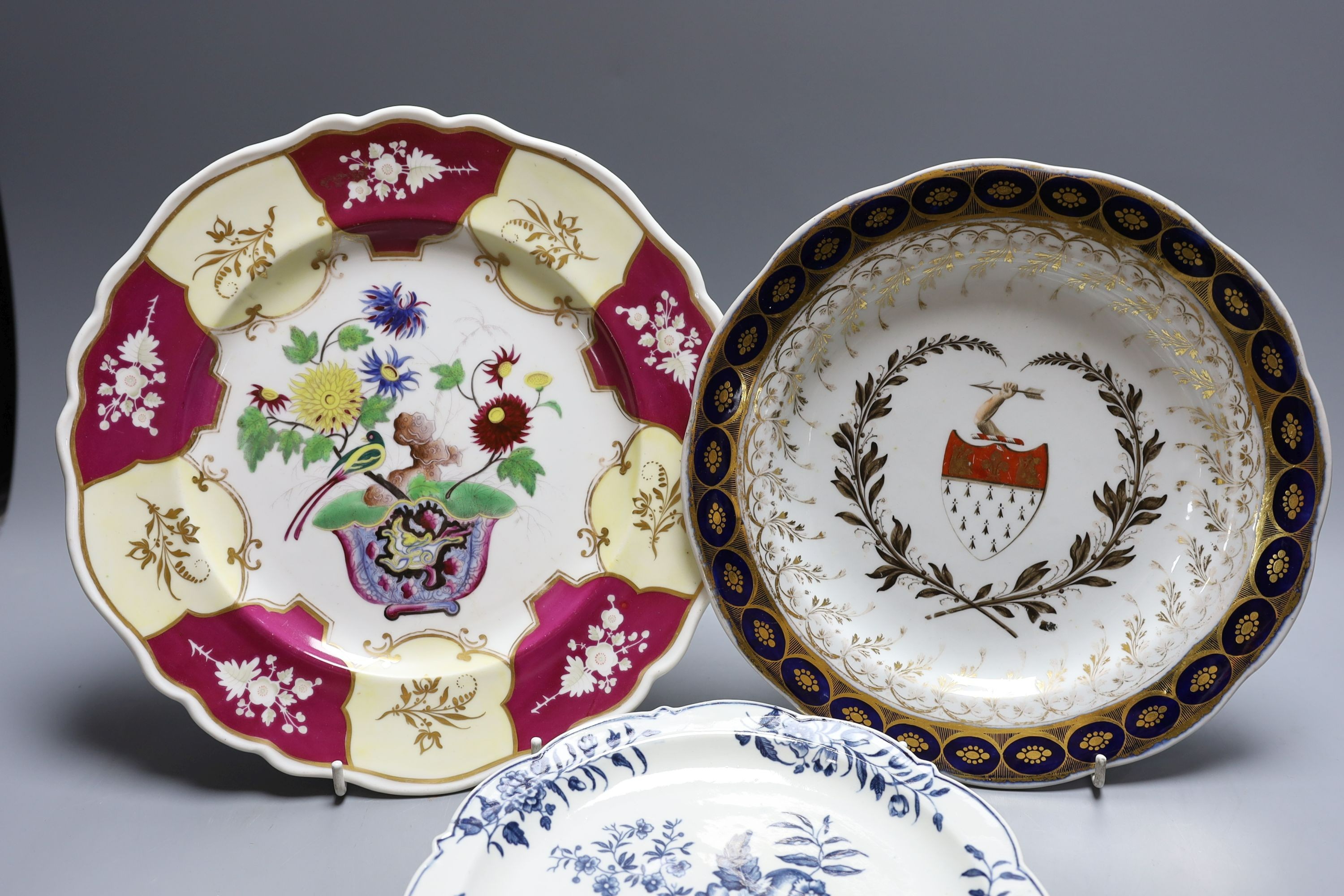 A Chamberlains Worcester armorial plate, a Worcester pinecone pattern plate, c.1775 and a Chamberlains Worcester chinoiserie plate (3) largest 27cm diameter